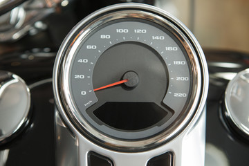 motorcycle speedometer and part of the gas tank