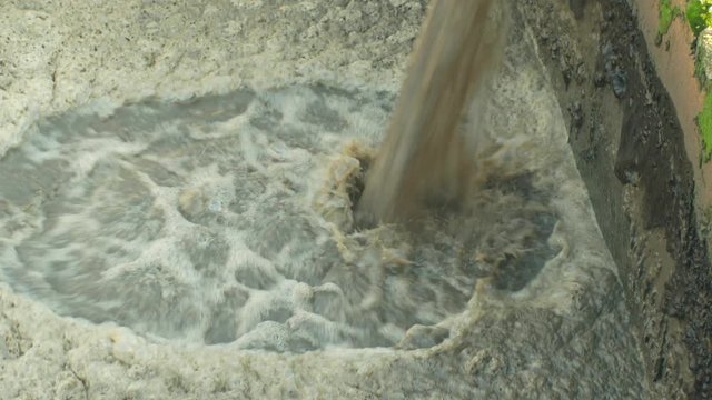 Discharge of waste water into segment clarifier biological purification of water sewage treatment plant, bubbles tank, activated sludge wastewaters process aeration and biology floc composed bacteria