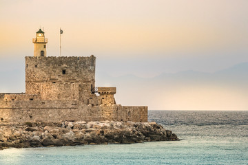 Fototapeta na wymiar The lighthouse at Mandraki Harbour, Rhodes, Greece.