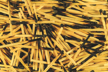 Burnt matches, big slide, close. Charred heads. View from above