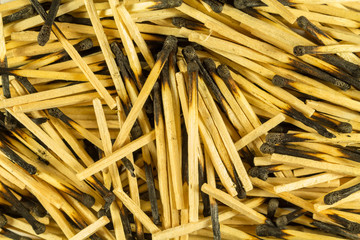 Burnt matches, big slide, close. Charred heads. View from above