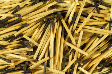 Burnt matches, big slide, close. Charred heads. View from above