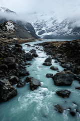 Beautiful view of the blue turquoise river in Hooker Valley track. Mount Cook National Park.