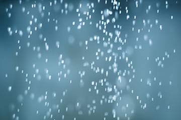 falling snow, abstract blue bokeh background