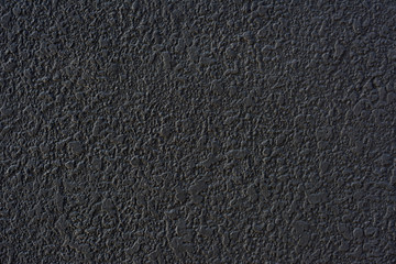 Rough black cement plastered wall texture