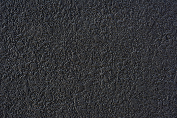Fototapeta premium Rough black cement plastered wall texture