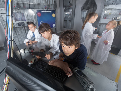 five children solve task in the bunker quest room