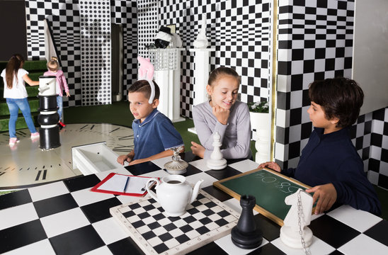 kids  play in lost room in chess style