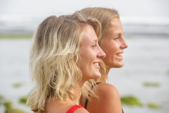 Headshot of two beautiful happy girls, outdoor  image with a natural light