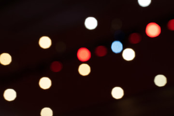 Background of light bokeh from spotlight in night place.