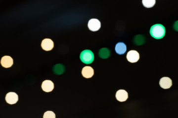 Obraz premium Background of light bokeh from spotlight in night place.