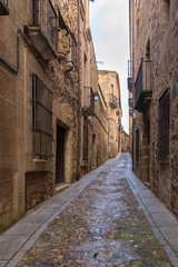 CACERES, SPAIN - NOVEMBER 25, 2018: typical medieval narrow street of the historic center of the city