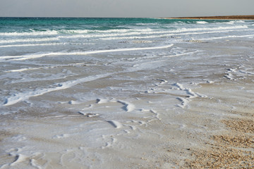 Dead Sea seashore in the evening in cloudy weather