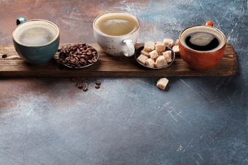 Fototapeta na wymiar Coffee cups, beans and brown sugar