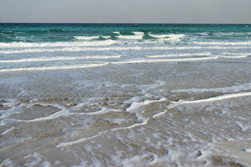 Dead Sea seashore in the evening in cloudy weather