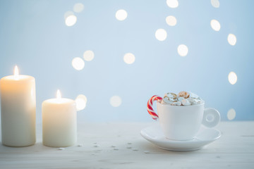 hot chocolate with marshmallow on blue  background