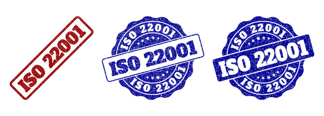 ISO 22001 scratched stamp seals in red and blue colors. Vector ISO 22001 overlays with draft surface. Graphic elements are rounded rectangles, rosettes, circles and text titles.