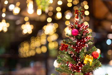 Close-up of Christmas decorations. Red and gold balls on a Christmas tree.