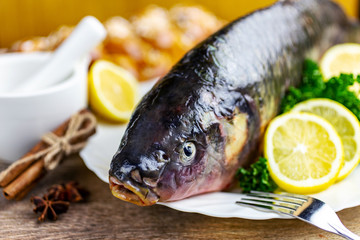Czech christmas time and customs - bohemian cuisine and typical fish - traditional carp prepared for festive dinner cooking