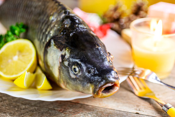 Czech christmas time and customs - bohemian cuisine and typical fish - traditional carp prepared for festive dinner cooking