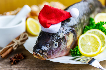 Czech christmas time and customs - bohemian cuisine and typical fish - traditional carp prepared for festive dinner cooking