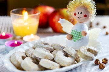 Czech christmas time and customs - bohemian cuisine and typical angel decoration - traditional nut rolls  sweets prepared for festive dinner