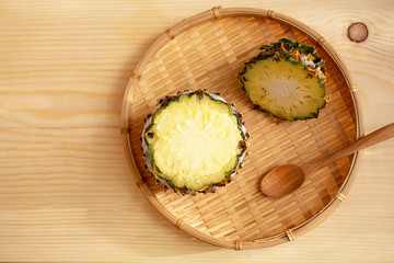 Pineapple Ice Cream. Ice cream in pineapple on wooden background.