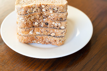 Slices of Whole grain bread on white plate