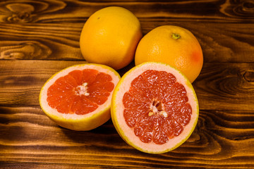 Ripe juicy grapefruit on a wooden table