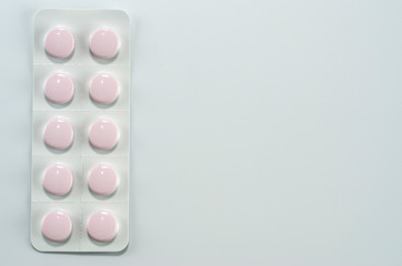 Plate with medical pills packed shot close up