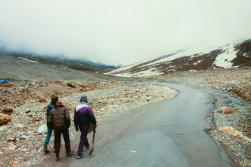 People Waliking on a road in the himalayas