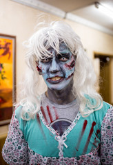 Close-up portrait of a horrible scary zombie man. Horror. Halloween.