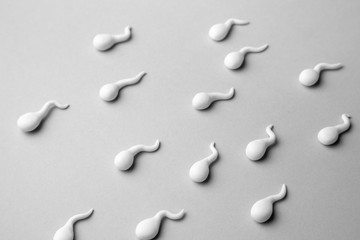 Group of sperm on gray background