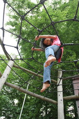 Portrait of a young cute girl on a playing field