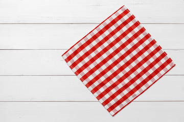 checkered tablecloth on wooden table