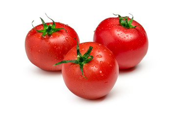 Three ripe  tomatoes isolated on white background