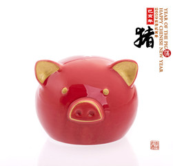 piggy bank,Chinese calligraphy translation: pig.Red stamps translation: Chinese calendar for the year of pig 2019.Red calligraphy on pig mean good bless for money