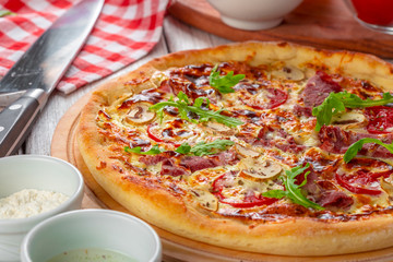 Delicious fresh pizza served on wooden table