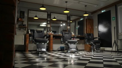 the camera on the Steadicam shows the interior of a Barber shop with a beautiful design.
