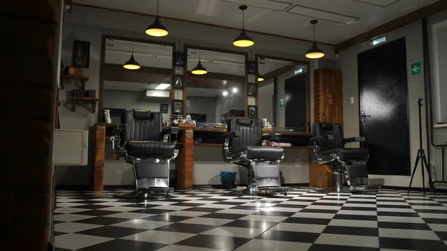 the camera on the Steadicam shows the interior of a Barber shop with a beautiful design.