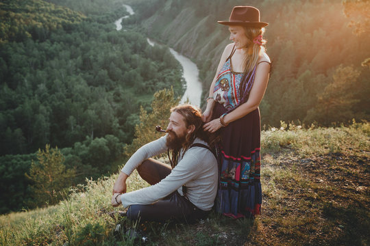 Sensual hipster couple in boho clothes in nature. Summer photo