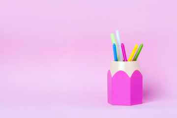 Mock up picture of pencil holder on pink background.