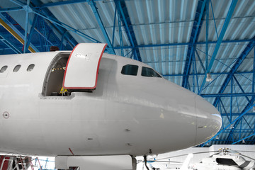 The nose of the aircraft cockpit in the maintenance hangar.