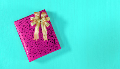Top view on gift box with bow on wooden background with copy space for Christmas, new year, birthday or Valentine gift. greeting card holidays concept.