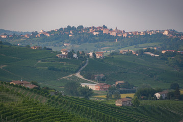 Langhe monferrato region autumnal hills and vineyards with mountains on background in Piedmont, Northern Italy.