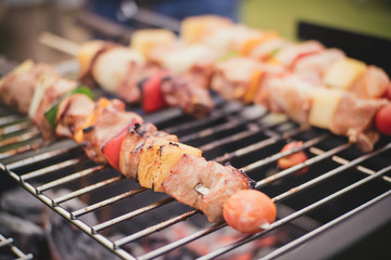 Hot barbeque (BBQ) grilling on the grill at the backyard