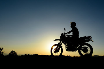 Fototapeta na wymiar Motorcycle travel and sunrise time beauties