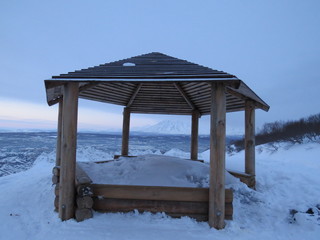 Wooden gazebo on the mountain on a winter day