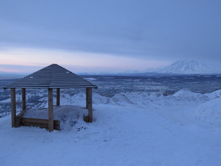 Wooden gazebo on the mountain on a winter day