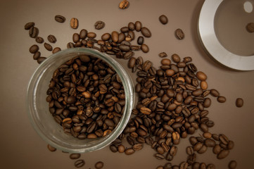 coffee canister lid and coffee beans scattered on the table